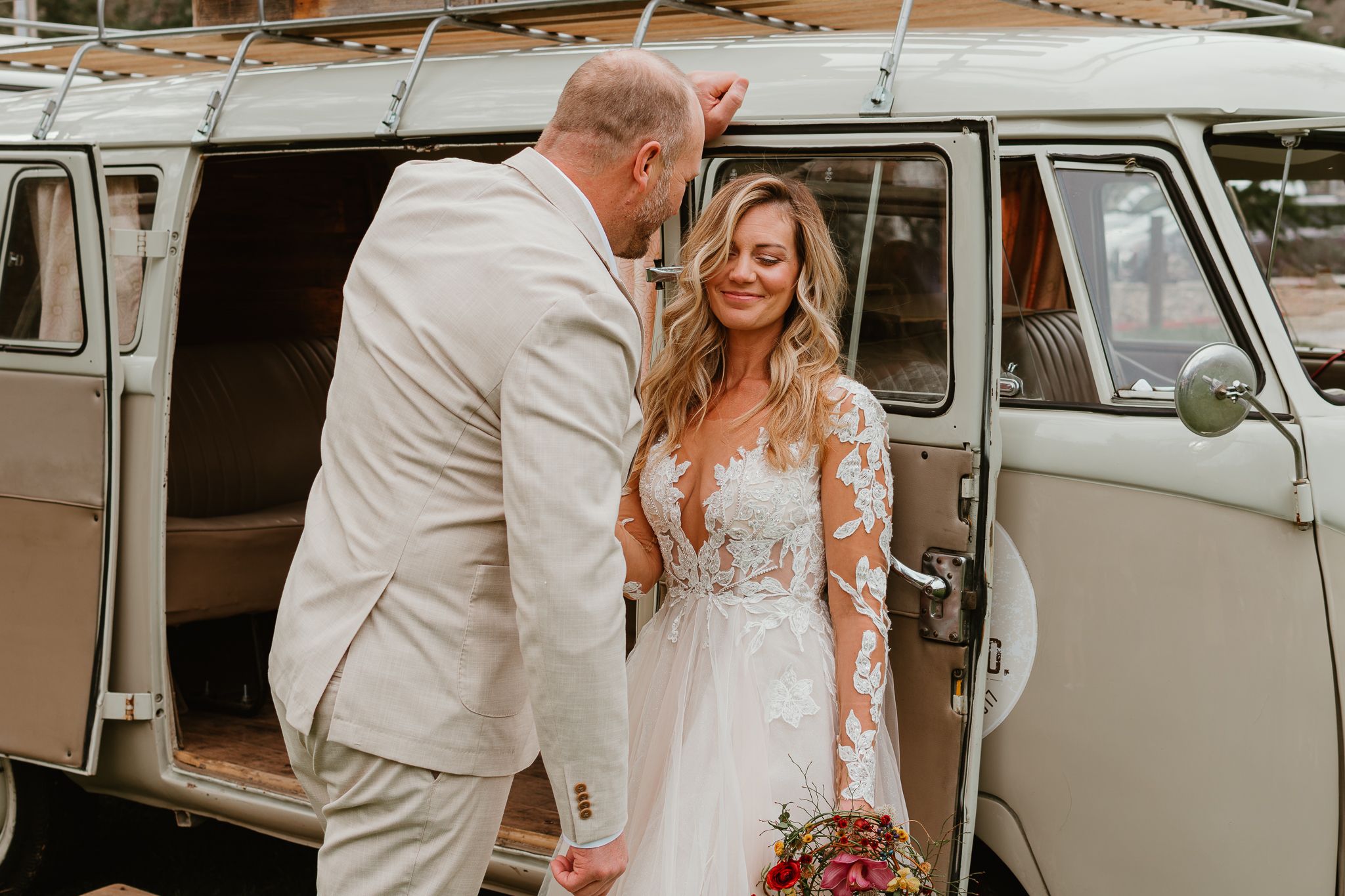 Vintage VW van wedding photos with classic cream-colored vehicle and romantic poses.