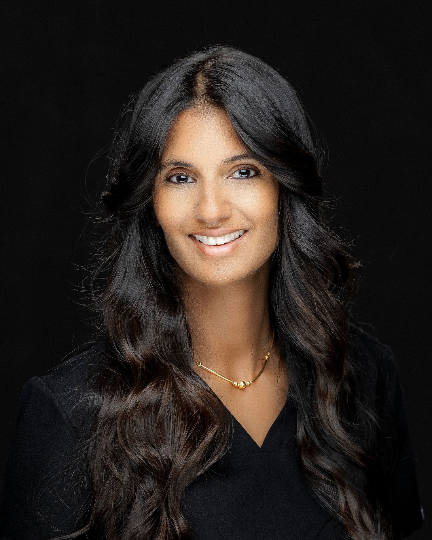 Professional headshots feature a person in black attire against dark background with dramatic lighting.