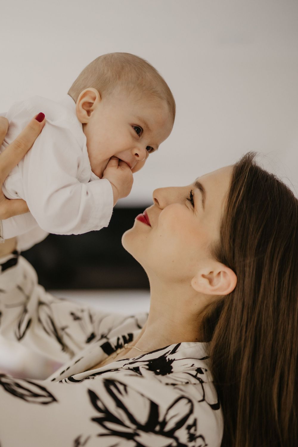 Joyful moment between parent and baby showing genuine happiness and connection.