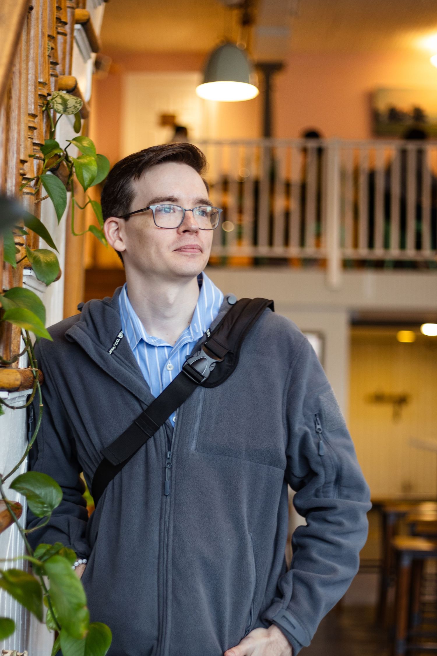 Portrait photographer Chris Suits standing in Coffee shop in Richmond Virginia