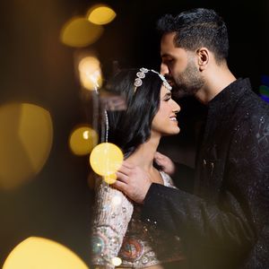 A romantic wedding couple in Houston, shares an intimate moment during their Sangeet ceremony.
