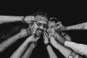 A black and white collage of hands covering eyes in a see no evil gesture against dark backgrounds.