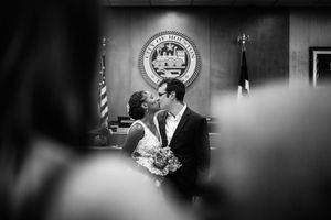 Black and white wedding ceremony photos showing intimate moments in a church setting.