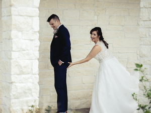 A American bride and groom share intimate moments during their first look.