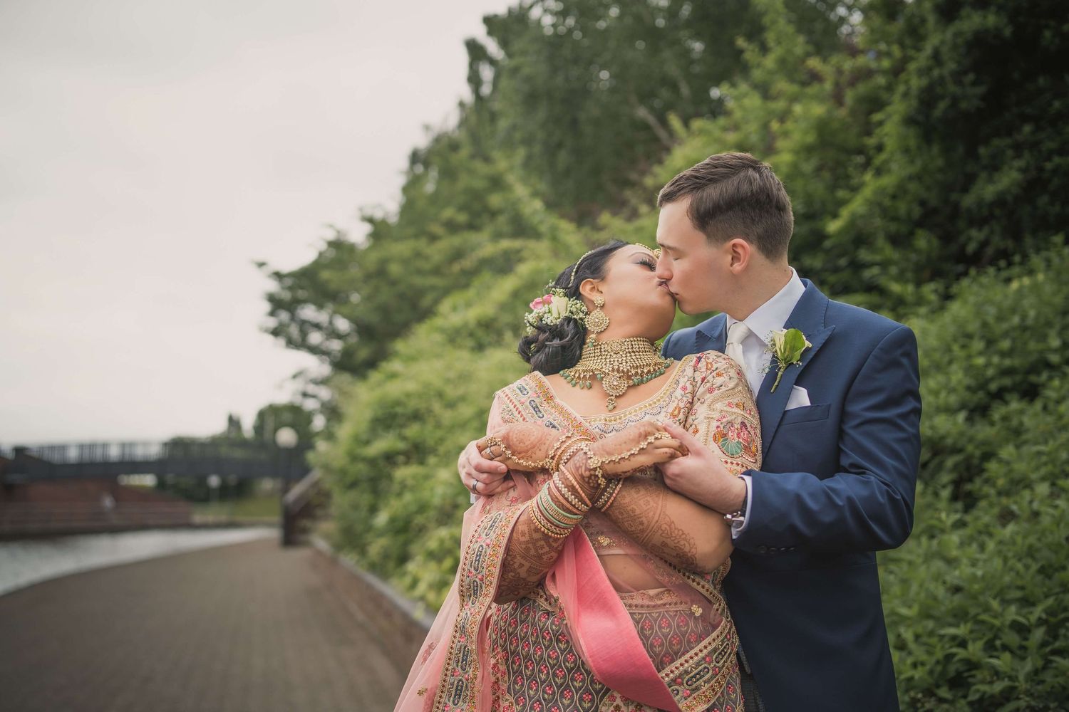 Happily married couple first kiss after marriage feeling excited and loved