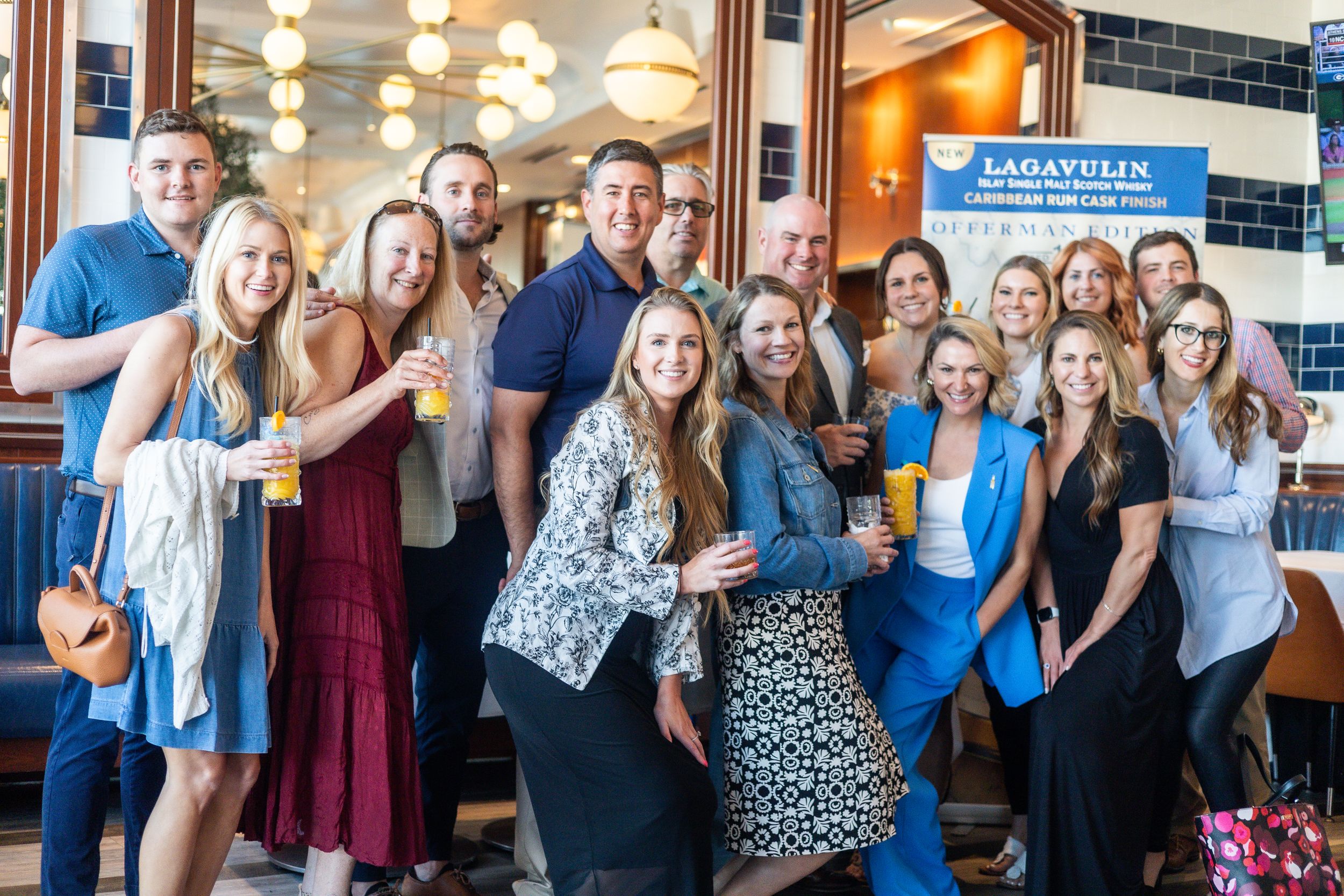 Large group gathered for a social event at a restaurant.