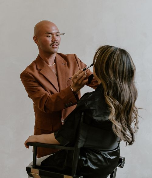 Los Angeles hair and makeup artist working on a client.