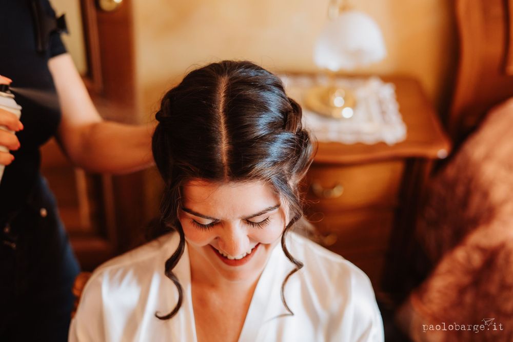 Candid moment during wedding preparations in natural light.