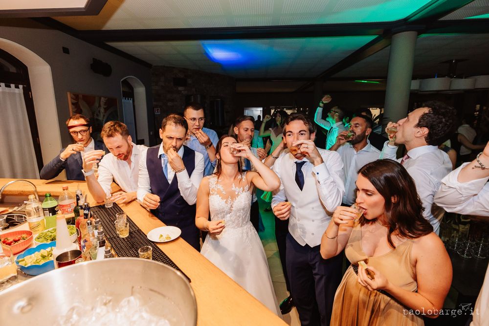 Wedding reception dance floor filled with joyful guests and celebratory energy.