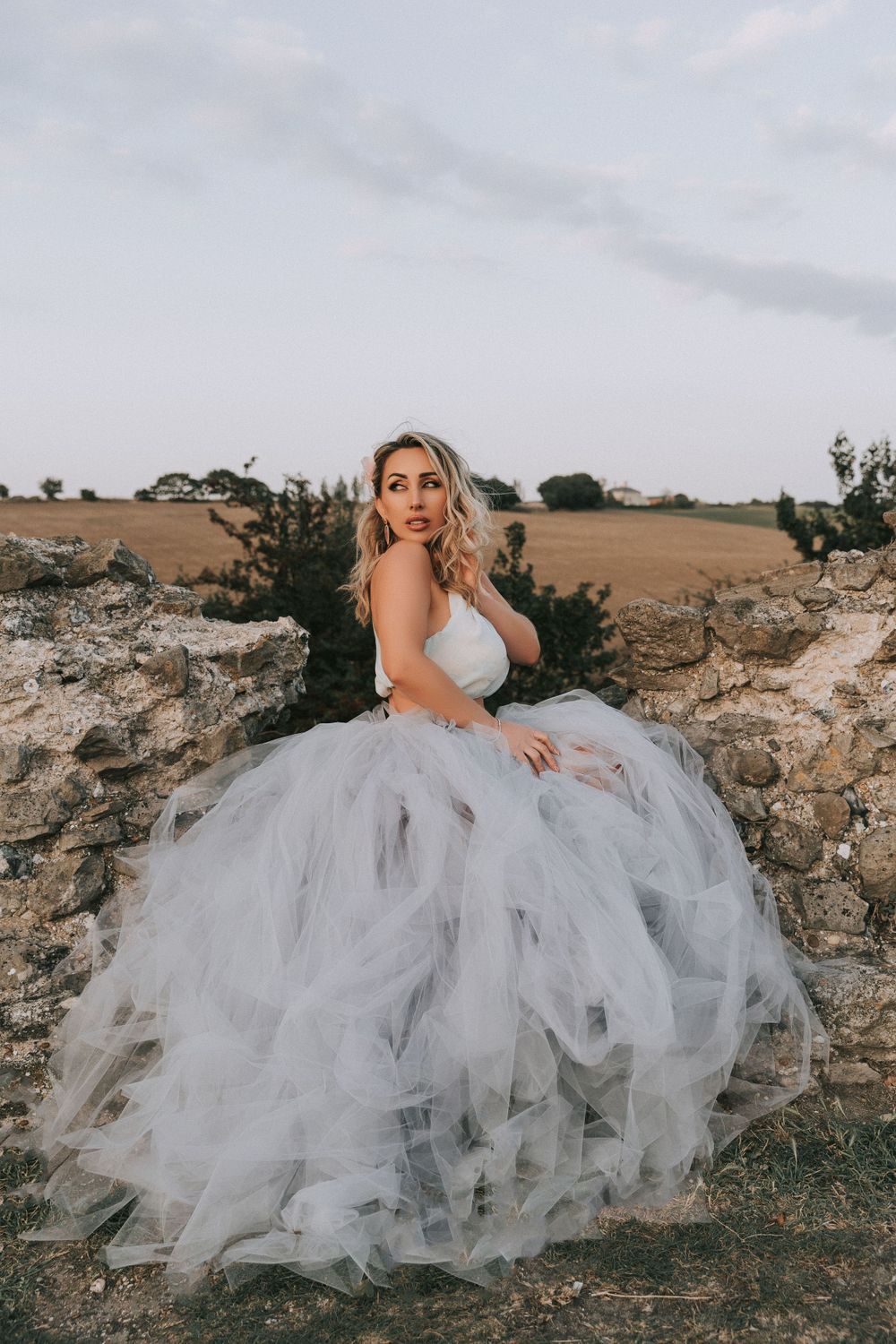 girl dressed in blue and purple hue dress Hadleigh Castle golden hour