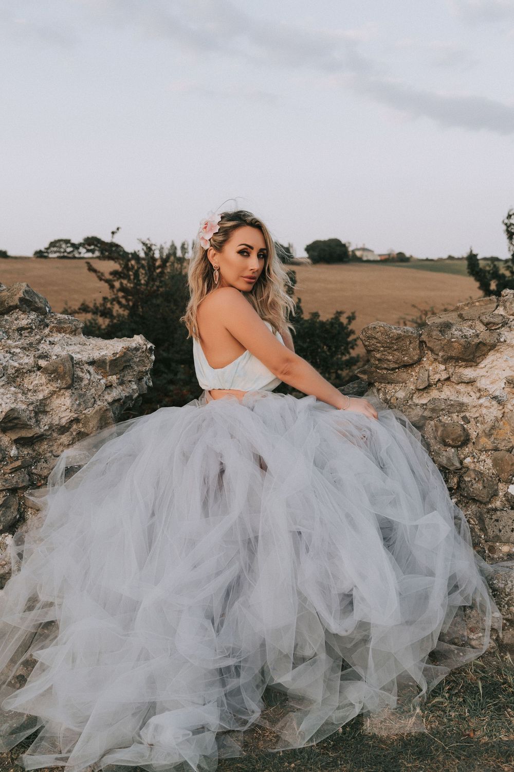 girl dressed in blue and purple hue dress Hadleigh Castle golden hour