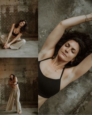 Moody dance photoshoot in an industrial space showing graceful stretching and artistic poses in monochromatic tones.