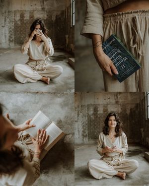 A cozy reading session featuring cream-colored loungewear and a dark hardcover book in a rustic indoor setting.