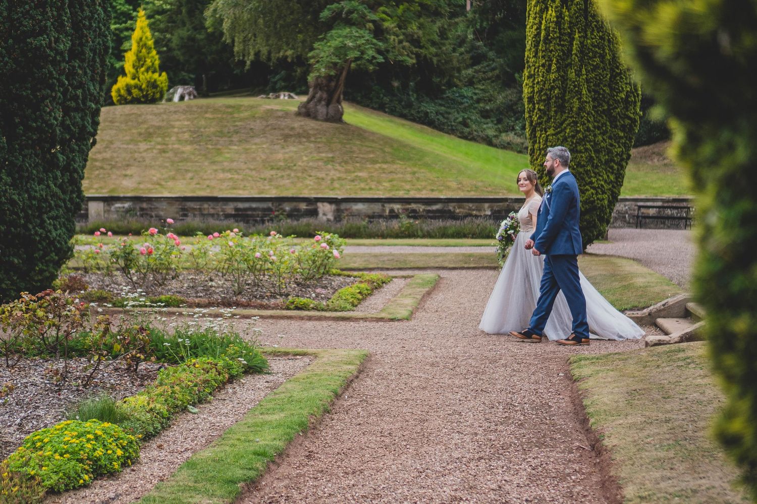 Bride and groom walking hand in hand