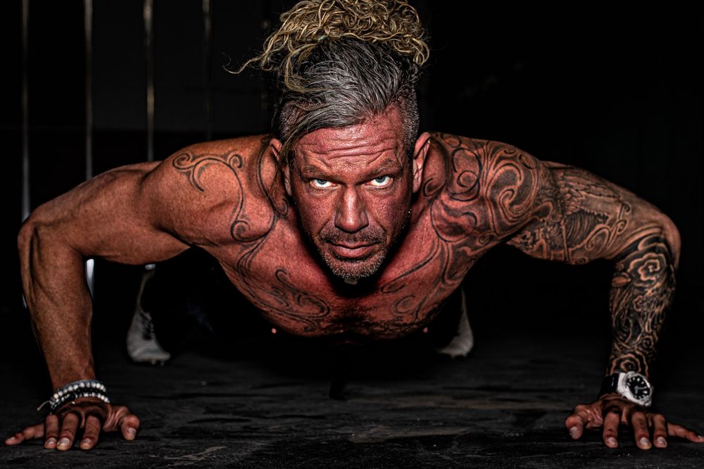 Truly Juli Photography business branding image of a fitness trainer performing a push up