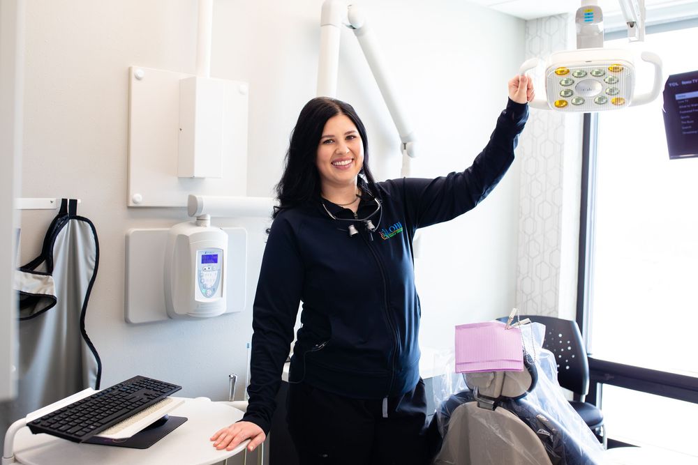 Dental hygienist posing for a photo in a dentist office
