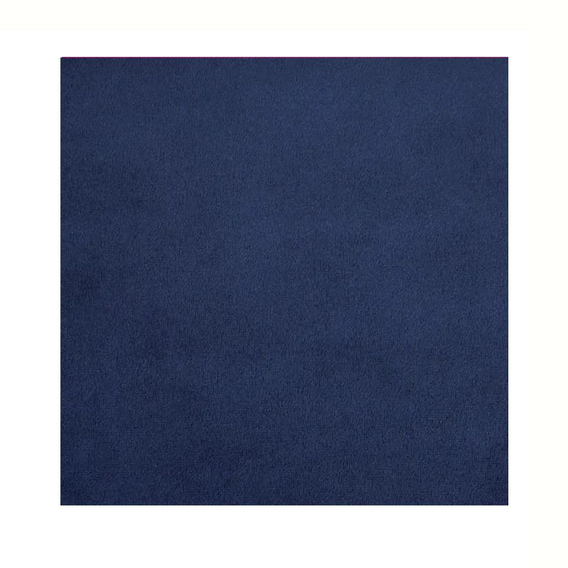 Navy blue square fabric backdrop with subtle textural detail.