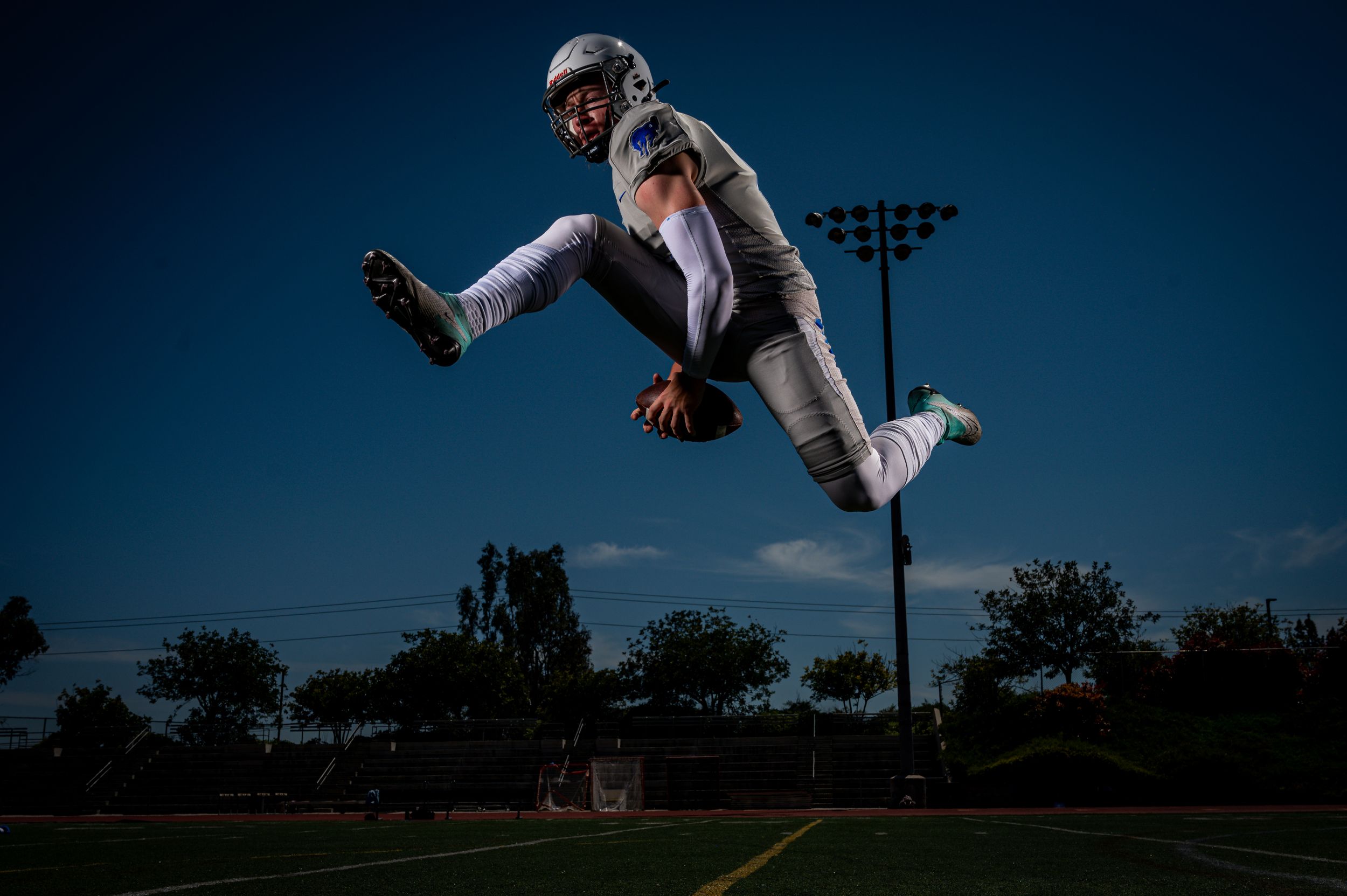 Football player jumping in air.