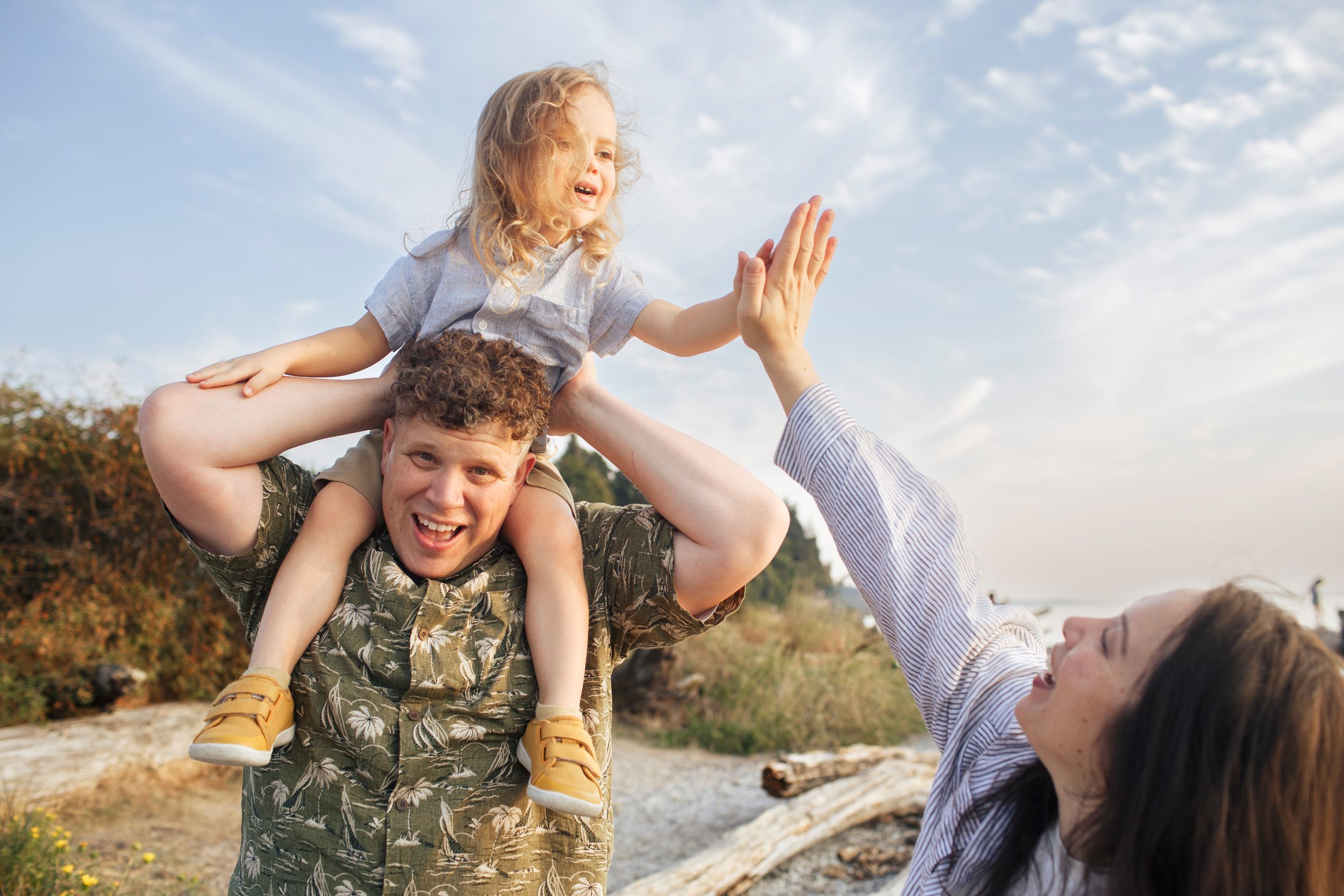 Affordable family photography in Everett WA: A family of five pose during a photo shoot at the Mukilteo lighthouse