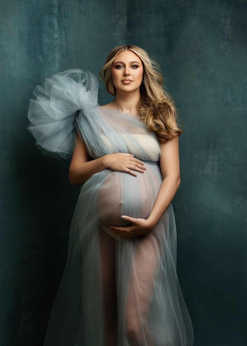 Beautiful maternity photography in Oklahoma by top-rated photographer capturing expecting mother’s glowing belly and joyful moments