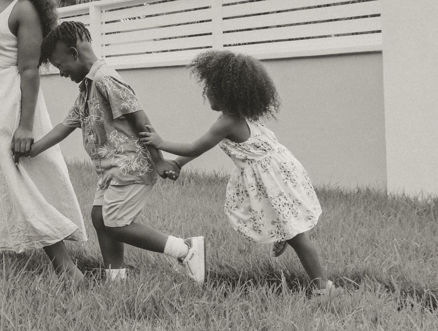 Candid moment of playful dancing and movement on a sunny day in the yard.