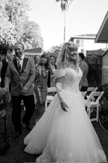 Black and white photos showing joyful moments at a wedding celebration with guests in formal attire.
