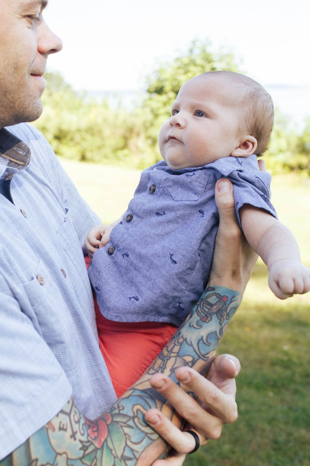 Harborview Park family photos in Mukilteo WA: A dad with his newborn baby at a family photo session