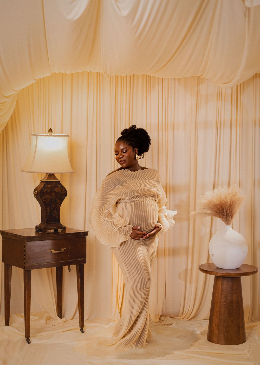 A series of vintage-style photographs showing decorative hats and accessories displayed on wooden tables against cream curtains.