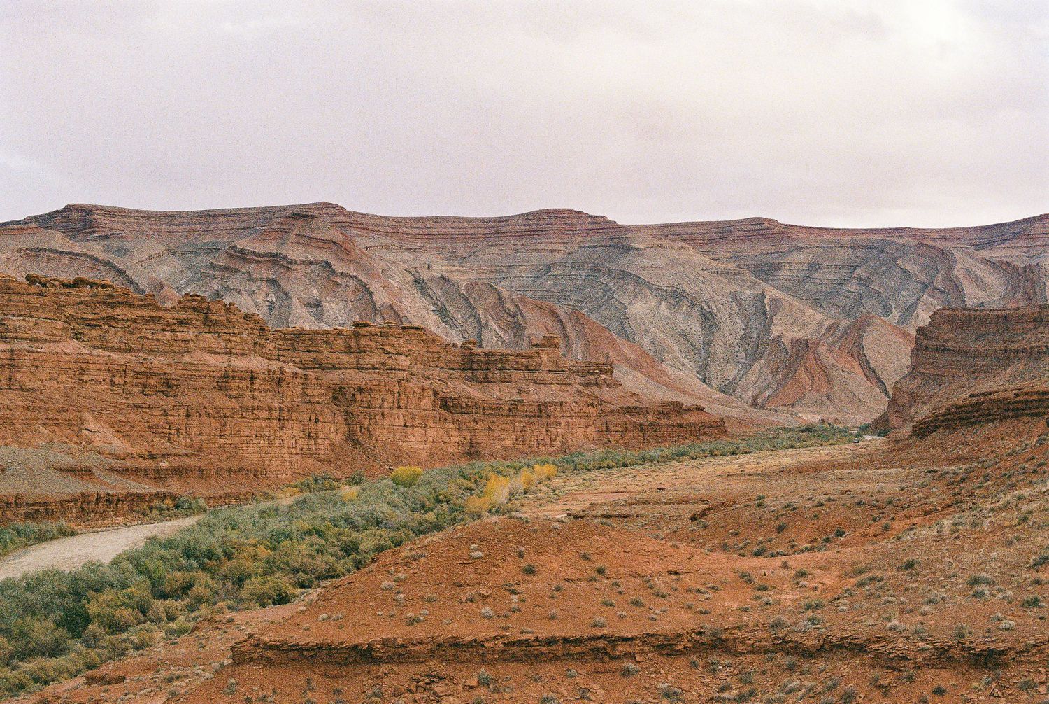 Panoramic view of red rock canyons and desert terrain in Utah's scenic landscape.