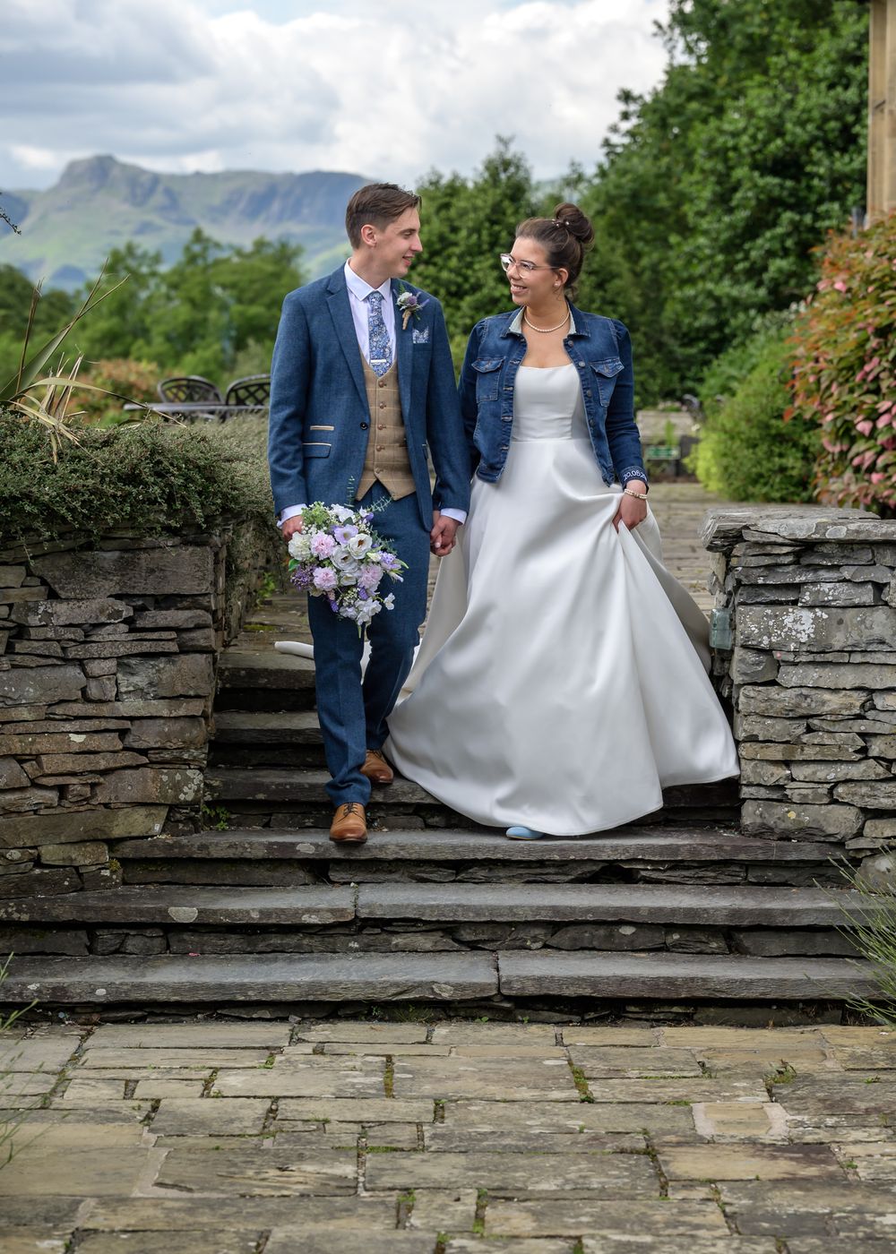 Bride and groom on steps from terrace at Cragwood Country House