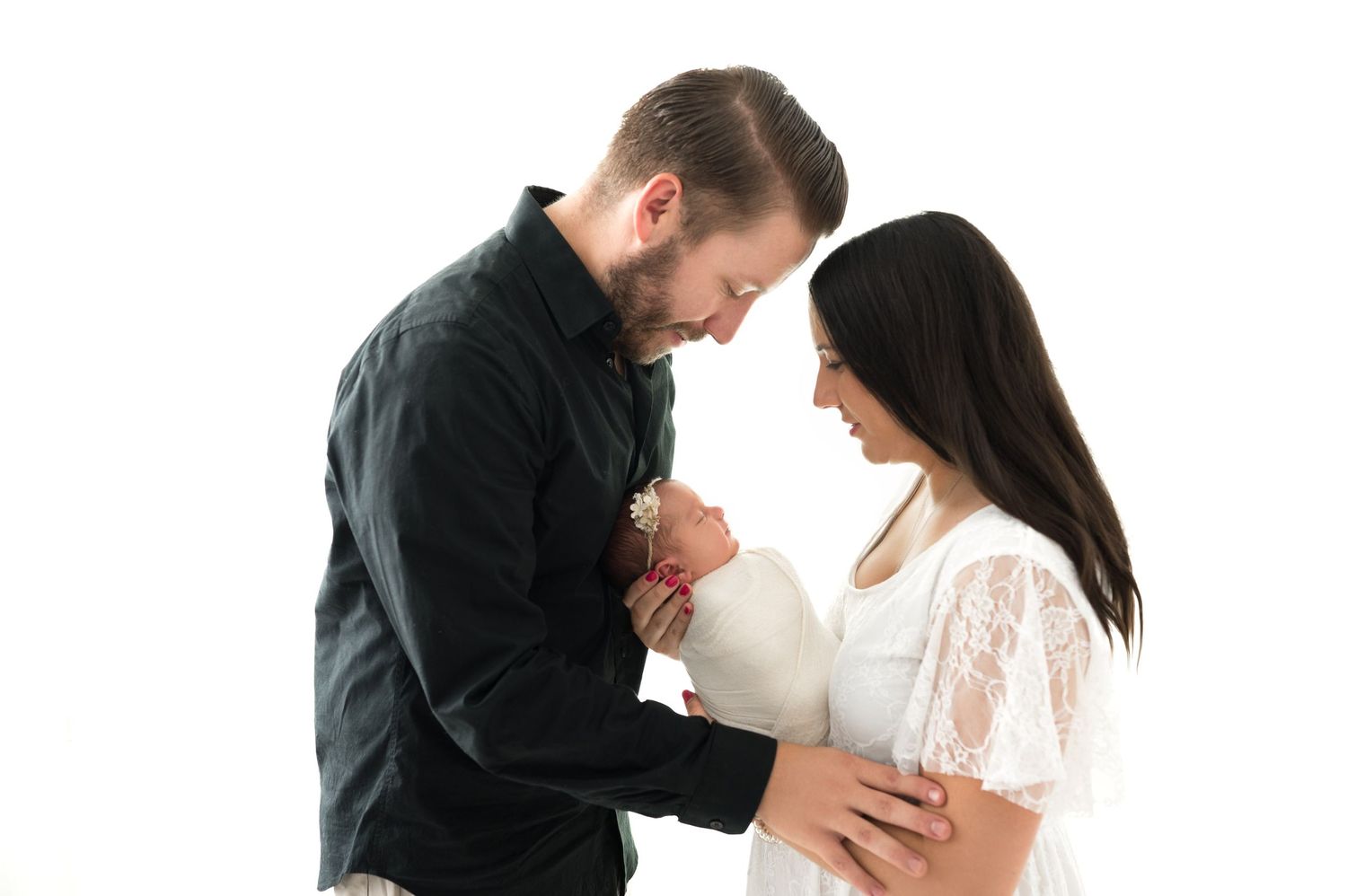 parents holding their baby in their arms and smiling during the newborn session in Woodbury MN