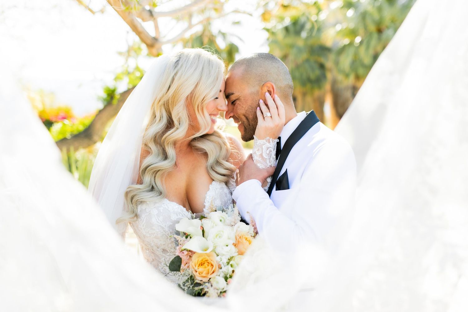 Bride and groom share a kiss at Desert Willow Golf course