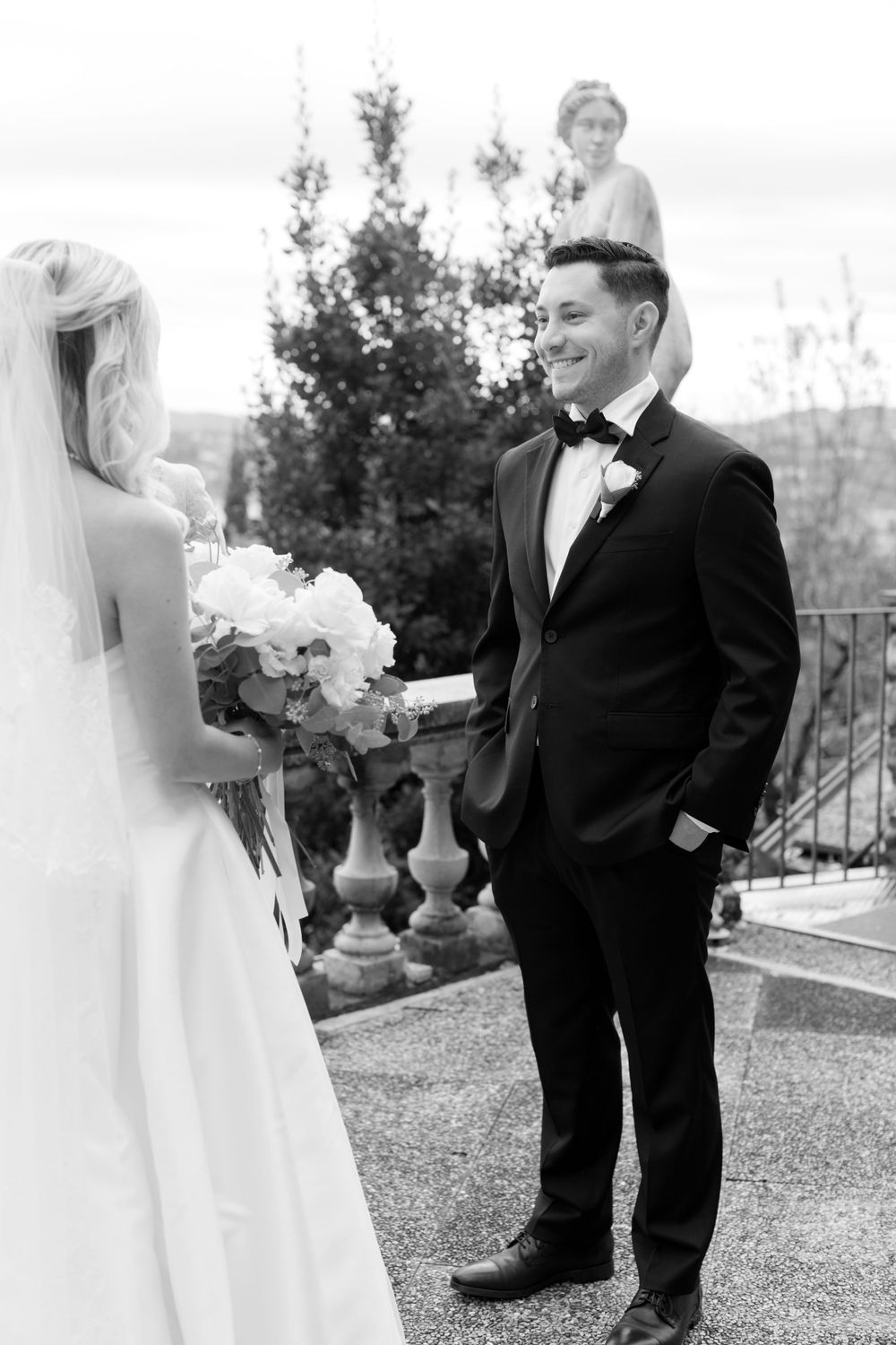Couple eloping at sunset on Isola del Garda with lake views