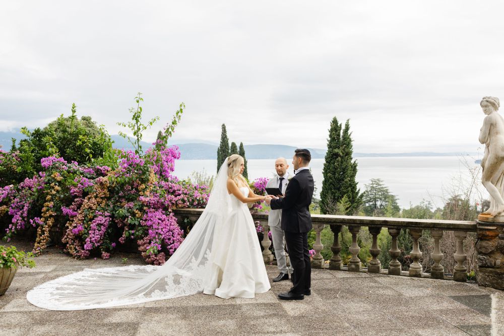 Couple eloping at sunset on Isola del Garda with lake views
