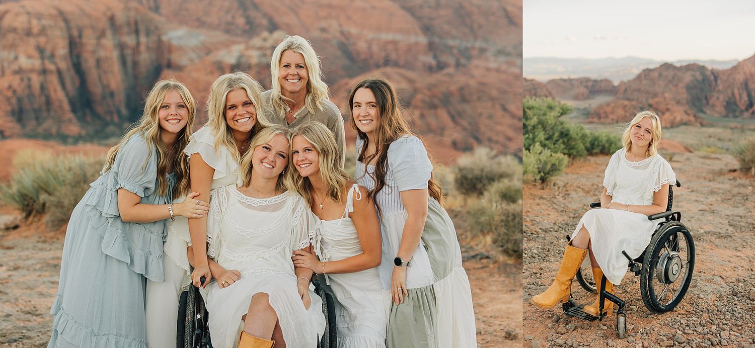 Group of women in white and blue dresses posing in a red rock desert landscape, one seated in a wheelchair.