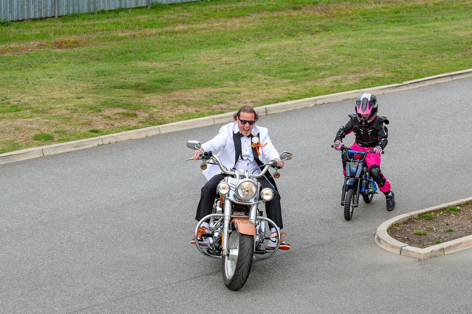 Groom enters the wedding venue on his motorcycle.Yorkshire, Sheffield, Lincolnshire, UK, Rotherham, Leeds