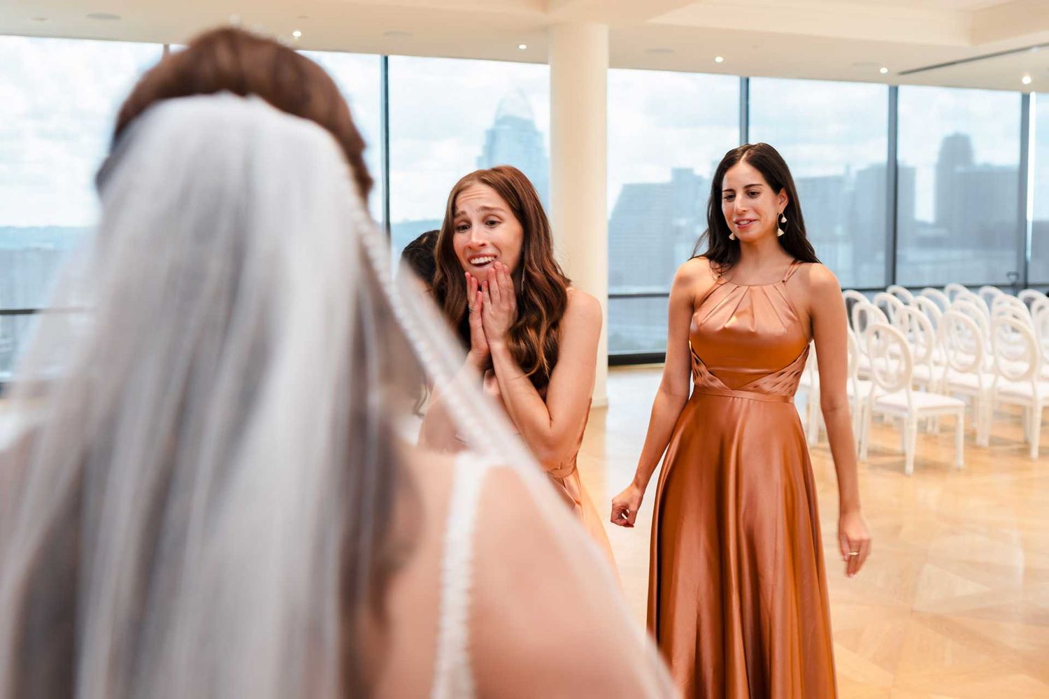 Bridesmaids first look with bride at the view venue