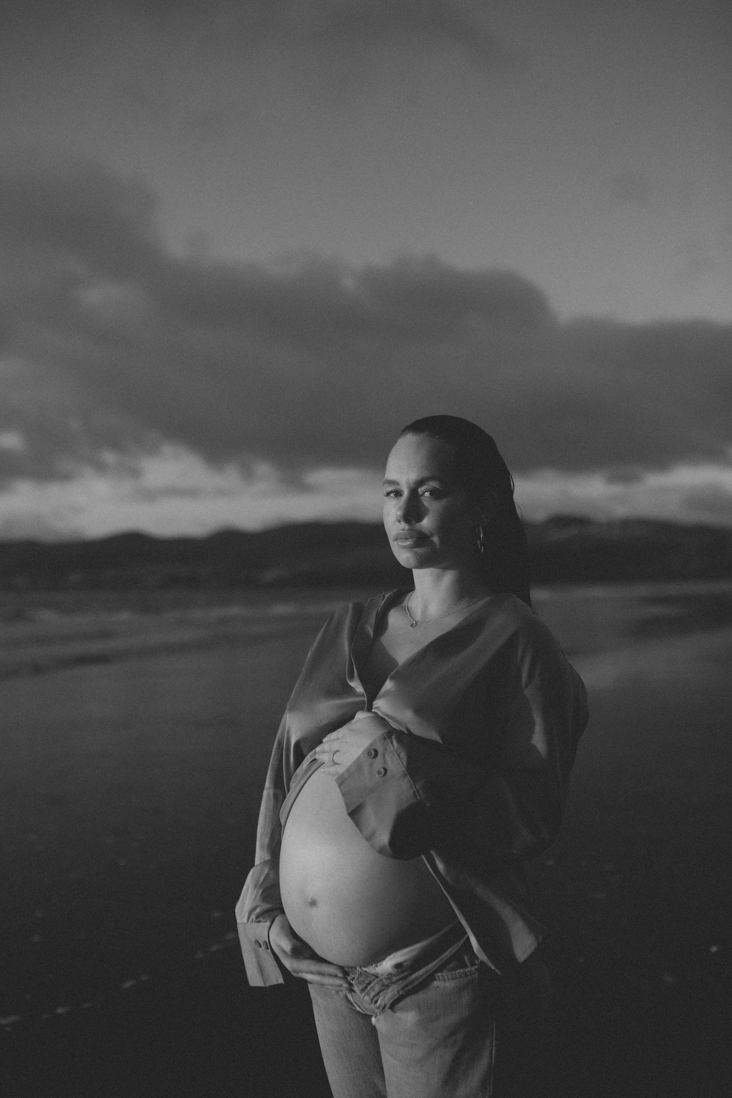 Black and white photo maternity portrait taken in Raglan, New Zealand by Nami Creative