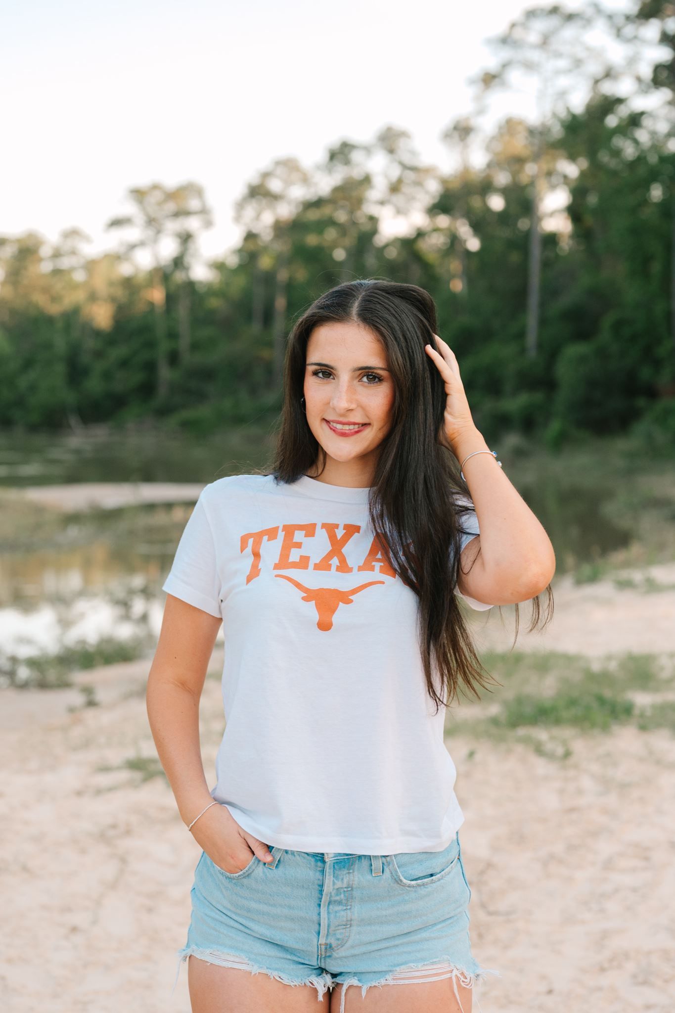 The Woodlands School senior girl posing on sand at Pundt Park in Spring Texas.
