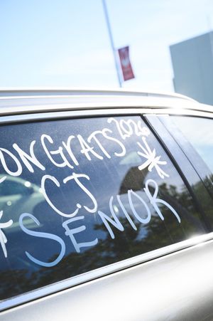 Car window painted with Congrats 2022 CJ Senior message celebrating a high school graduation milestone.