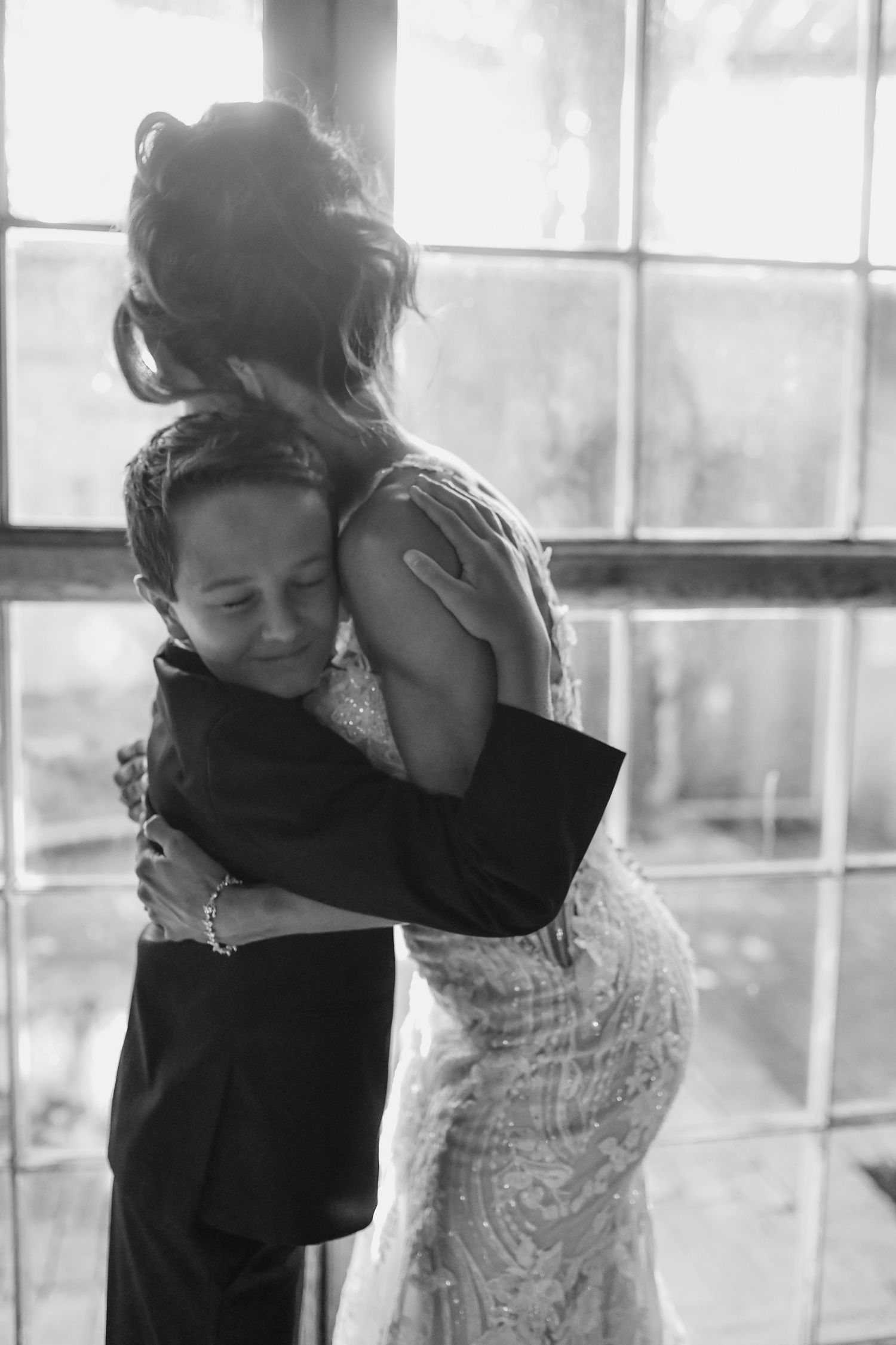 Candid mother and son wedding photography at The Cotton Mill