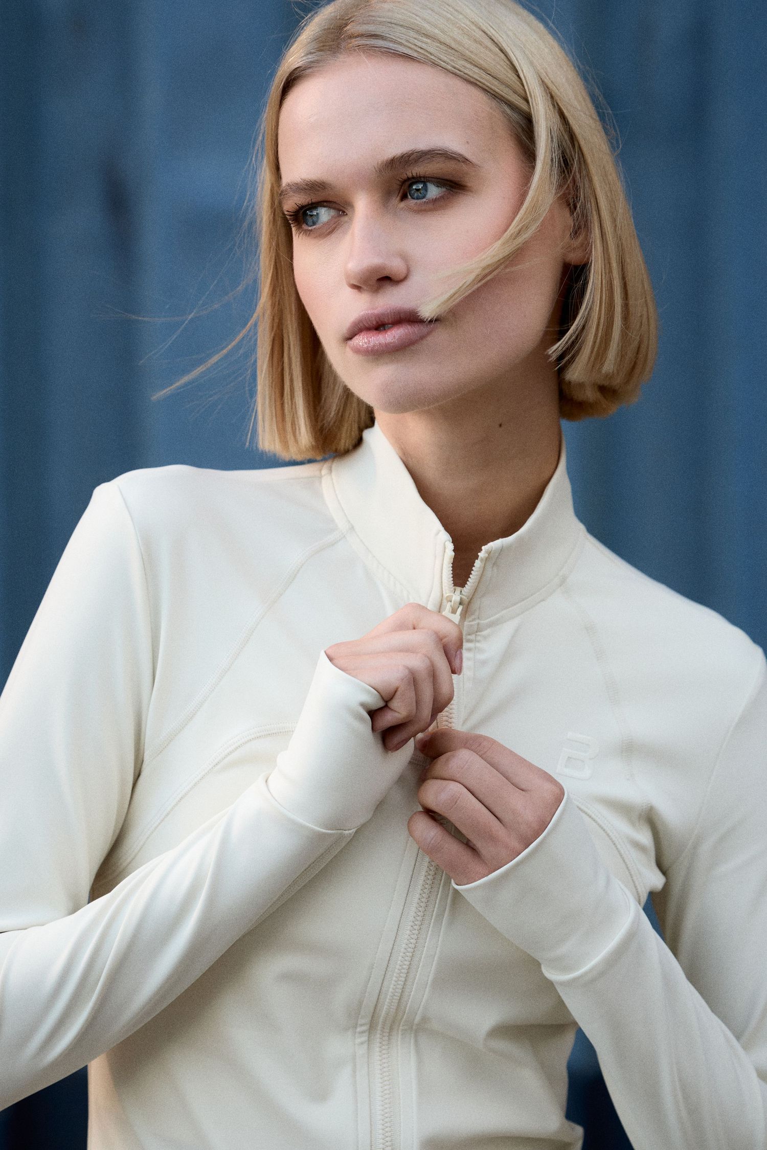 Model wearing BioTechUSA FW26 apparel in an industrial Budapest location