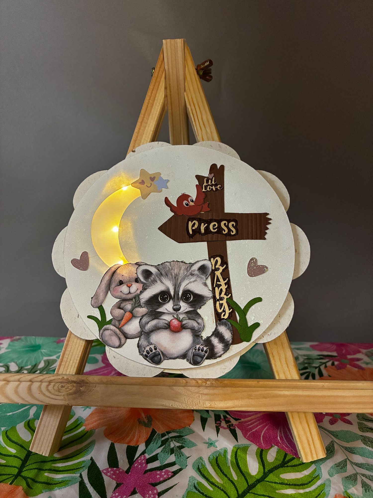 Circular card with a crescent moon that illuminates with a press of the wooden sign.