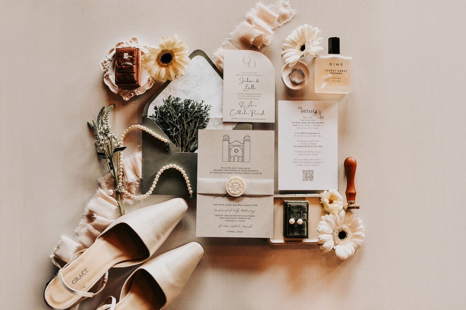 Elegant bridal flat lay with wedding rings and gold details