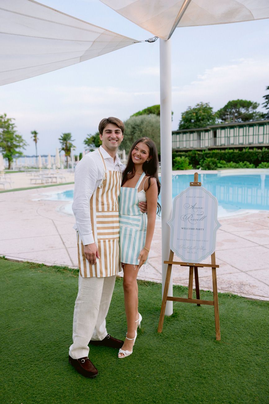 Romantic portrait of bride and groom during the welcome party of their destination wedding by the shores of Lake Garda. Solidea Events