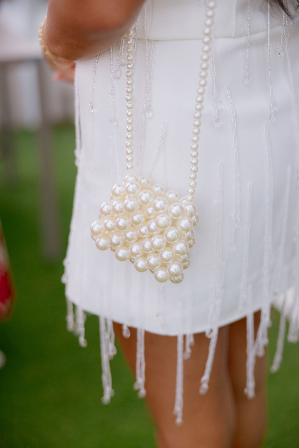 Cute detail of the bride's purse during her welcome party by the shores of Lake Garda.