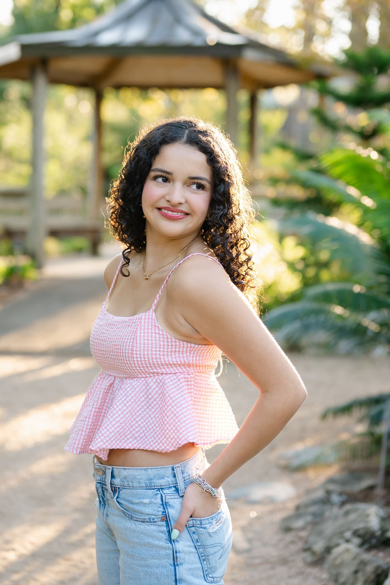 College Park High School senior pictures photographed along a garden pathway at Mercer Botanic Gardens.