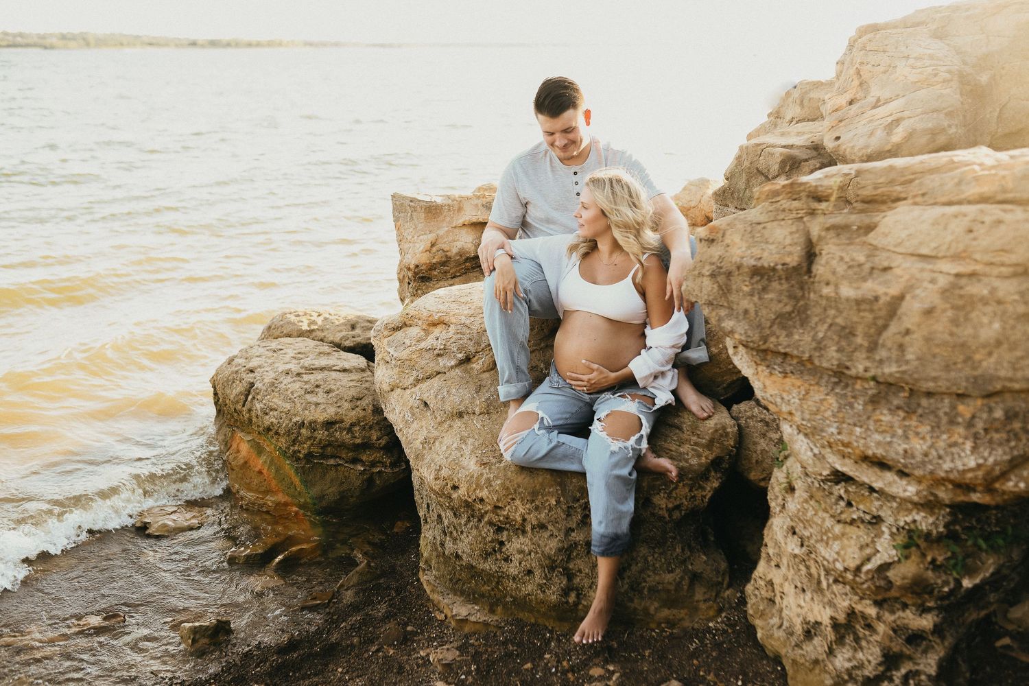 Expecting parents during a sunset maternity session at Lake Grapevine near Flower Mound, Texas