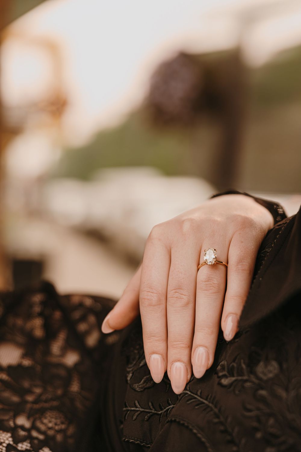 Bride shows off her ring in Downtown Livingston, Montana under the neon lights. Paradise Valley Photographer in Livingston, Montana