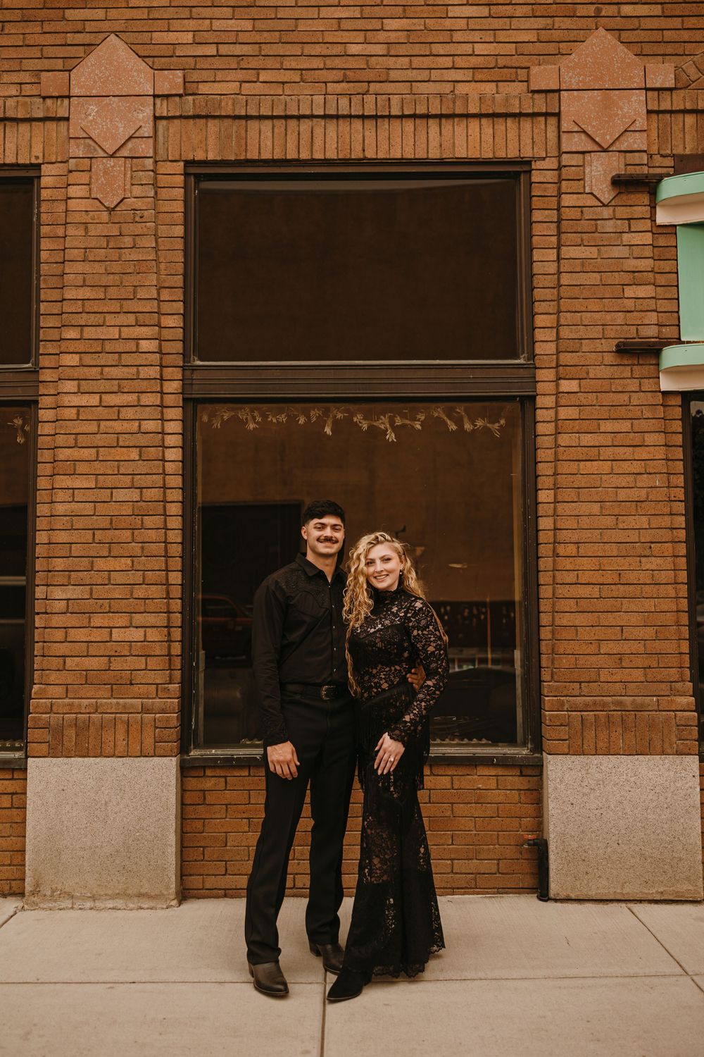 Couple poses in Livingston, Montana for their welcome party - Livingston Wedding Photographer captures Wedding Weekend in paradise Valley